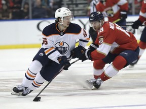 Edmonton Oilers right winger Kailer Yamamoto (56) skates against Florida Panthers defenceman Mike Matheson (19) on Saturday, Feb. 15, 2020, in Sunrise, Fla.