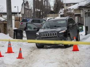 Police at the scene of a shooting in an alley near 120 Street and 134 Ave in Edmonton on Thursday, Feb. 20, 2020.