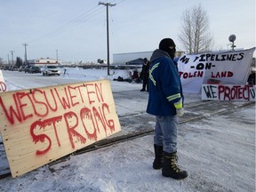 Protesters block the CN rail line near 213 Street and 110 Avenue in solidarity with Wet'suwet'en Hereditary Chiefs, in Edmonton Wednesday Feb. 19, 2020.