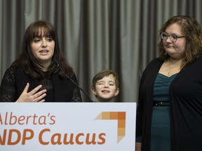Parent Shantel Sherwood, left, and son Orrin, with NDP education critic Sarah Hoffman, are calling on Education Minister Adriana LaGrange to reverse her cuts to supports for students with complex needs on Tuesday, Feb. 18, 2020.