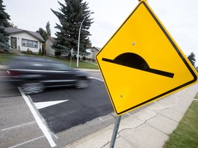 Traffic makes its way over a traffic calming speed bump near 64 Street and 94 B Avenue. (Postmedia, File)