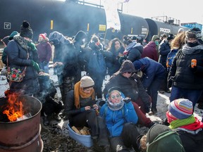 Supporters of the indigenous Wet'suwet'en Nation occupy railway tracks as part of a protest against British Columbia's Coastal GasLink pipeline, in Toronto, Ontario, Canada Feb. 15, 2020.