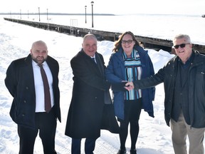 Mike Chadi and Sid Chadi, of Fourth Group, with Wabamun Mayor Charlene Smylie and Frank Florkewich at the new Discovery Wharf Development in Wabamun.