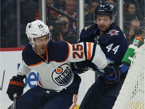 Winnipeg Jets defenceman Josh Morrissey (right) chases Edmonton Oilers defenceman Darnell Nurse during NHL action in Winnipeg on Sun., Oct. 20, 2019.