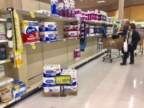 Toilet paper shelves are nearly empty at an Edmonton grocery store in the Terwillegar area on March 3, 2020.