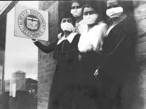 Alberta Government Telephones operators in High River wore compulsory masks during the 1918 Spanish flu epidemic. From left to right: Gladys Stephenson, Cora Stephenson, Addie McDonald and Annie Grisdale
