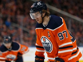 Edmonton Oilers' Connor McDavid (97) faces off against Winnipeg Jets' Mark Scheifele (55) during first period NHL hockey action at Rogers Place in Edmonton, on Saturday, Feb. 29, 2020.