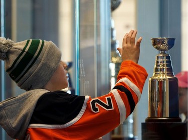 Hunter Hudson, seen looking over a mini Stanley Cup in the Edmonton Oilers Hall of Fame room, was one of 65 kids who signed a one-day contract and became an Edmonton Oiler during Boston Pizza's Oiler for a Day event held at Rogers Place in Edmonton, on Sunday, March 1, 2020.