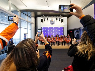 Parents take photos of their kids during Boston Pizza's Oiler for a Day event held at Rogers Place in Edmonton, on Sunday, March 1, 2020. The young athletes signed one day contracts and met members of the Oilers organization while learning what it takes to play in the NHL.