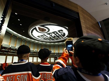 Participants view the Edmonton Oilers dressing room during Boston Pizza's Oiler for a Day event held at Rogers Place in Edmonton, on Sunday, March 1, 2020.