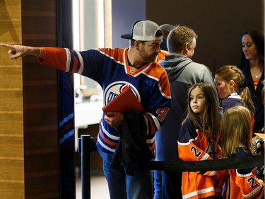 Participants view the Edmonton Oilers dressing room during Boston Pizza's Oiler for a Day event held at Rogers Place in Edmonton, on Sunday, March 1, 2020.