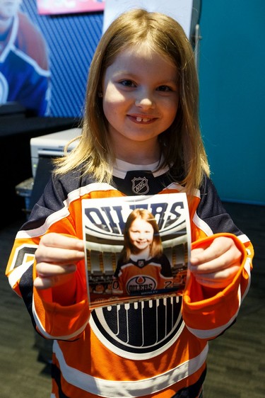 Newly minted Oiler for A Day Brinley Nelson holds her photo taken during Boston Pizza's Oiler for a Day event held at Rogers Place in Edmonton, on Sunday, March 1, 2020.