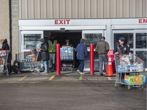 Many of the shoppers leaving the south Edmonton Costco were buying quantities of toilet paper on March 3, 2020. Stores across Canada have been selling out of some supplies as people fall prey to fear mongering over coronavirus.