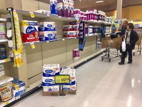 Toilet paper shelves are nearly barren at a Terwillegar grocery store on Tuesday, March 3, 2020.