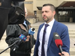 Staff Sgt. Ryan Tebb speaks to media outside police headquarters on March 4, 2020, about charges in a 1981 sexual assault case.