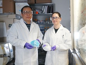 Hyo-Jick Choi, a biomedical engineer at the Universtiy of Alberta, left, is working on Monday, March 9, 2020, to create a mask that will kill viruses within 30 minutes of contact. Ilaria Rubino, right, is a researcher with not-for-profit Mitacs.
