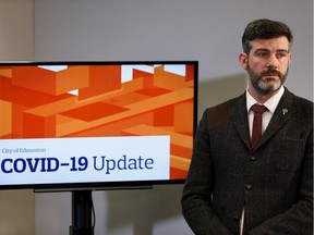 Mayor Don Iveson listens during a news conference after an emergency city council meeting on COVID-19 held at city hall in Edmonton on Friday, March 13, 2020.