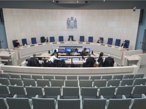 Edmonton city council held an emergency advisory committee meeting at city hall on Wednesday, March 18, 2020, Just four councillors and the mayor attended in person, the remaining councillors were on the phone.