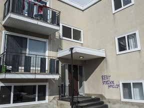 Graffiti on a walkup in Old Strathcona calling for a "rent strike" on April 1. While Alberta is making funds available to assist people with COVID-19 income losses, there are no plans as yet to restrict evictions.