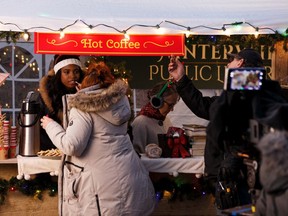 The cast and crew prepare to shoot a scene for the film Christmas Coronation by Northern Gateway Films at McIntyre Park in Edmonton, on Tuesday, March 24, 2020. The production has taken health steps recommended by the provincial government due the global COVID-19 coronavirus pandemic.