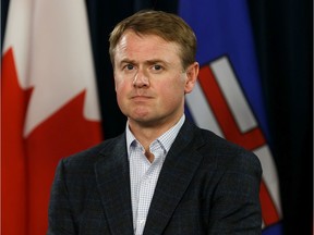 Tyler Shandro, Minister of Health, is seen during a news conference about the COVID-19 pandemic with Premier Jason Kenney and Dr. Deena Hinshaw, Chief Medical Officer of Health, at the Alberta Legislature in Edmonton, on Wednesday, March 25, 2020.