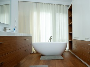 Ackard Contractors added a stylish soaker tub to this bathroom renovation. Once the pandemic subsides, “pent up demand” paired with low interest rates should provide strong support for home sales and renovation spending, says Peter Norman of Altus Group.