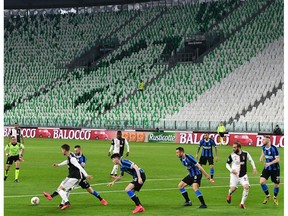 Inter Milan and Juventus players compete in an empty stadium due to the novel coronavirus outbreak during the Italian Serie A football match Juventus vs Inter Milan, at the Juventus stadium in Turin on March 8, 2020.