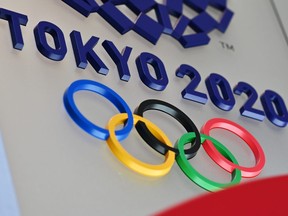 The logo for the Tokyo 2020 Olympic Games is seen in Tokyo. Senior International Olympic Committee (IOC) official Dick Pound said March 23, 2020 a postponement of this year's Tokyo Olympics is now inevitable as the world reels from the coronavirus pandemic.