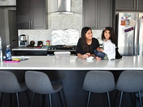 Zahra Rahimtoola and her daughter Aneesa, 3, play in their new home at the Hills at Charlesworth community.