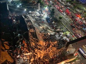 Rescuers search for survivors in the rubble of a collapsed hotel in Quanzhou, in China's eastern Fujian province on March 7, 2020.