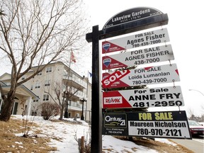 Realtor signs are displayed outside Lakeview Gardens in Edmonton.