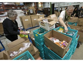 Volunteers pack food hampers at the Edmonton's Food Bank in November.