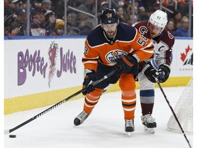 Edmonton's Anton Slepyshev (58) battles Colorado's Gabriel Landeskog (92) during the first period of a NHL game between the Edmonton Oilers and the Colorado Avalanche at Rogers Place in Edmonton, Alberta on Thursday, Feb. 22, 2018.