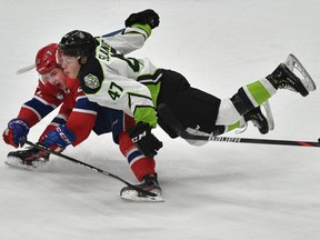 Edmonton Oil Kings' Keagan Slaney (47) is all over Spokane Chiefs' Luke Toporowski (22) at Rogers Place on Wednesday, March 4, 2020.