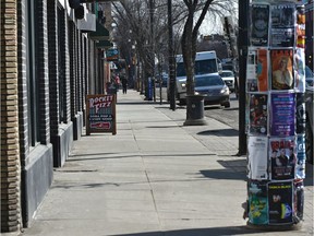 Unusually empty sidewalks along Whyte Avenue during the lunch hour in Edmonton on March 19, 2020.