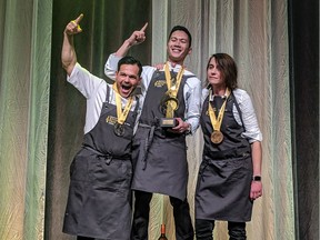 From the left, chefs Serge Belair (silver medalist), JP Dublado (gold medal) and Doreen Prei (bronze medal) share the podium at Canada's Great Kitchen Party in Edmonton on Oct. 17, 2019.