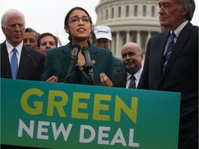 U.S. Rep. Alexandria Ocasio-Cortez (D-NY) speaks as Sen. Ed Markey (D-MA) (R) and other Congressional Democrats listen during a news conference in front of the U.S. Capitol February 7, 2019 in Washington, DC. Sen. Markey and Rep. Ocasio-Cortez held a news conference to unveil their Green New Deal resolution.