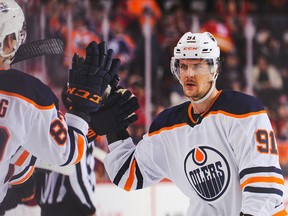 Gaetan Haas (91) of the Edmonton Oilers celebrates with the bench after scoring against the Calgary Flames at Scotiabank Saddledome on Feb. 1, 2020, in Calgary.