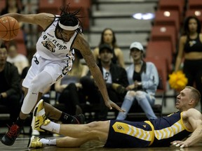 The Edmonton Stingers’ Jordan Baker (8) collides with the Saskatchewan Rattlers' Marlon Johnson (11) during second half CEBL action, at the Edmonton EXPO Centre Friday May 31, 2019. Edmonton won 93 to 84.