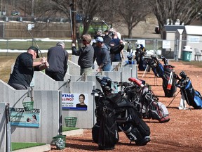 Golfers hone their skills at the Victoria Driving Range. File photo.