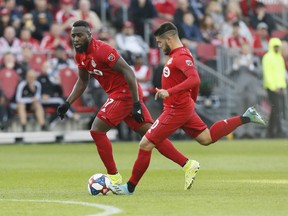 TFC’s Jozy Altidore (left) and Alejandro Pozuelo.