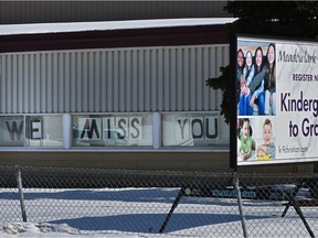 Signs in the windows says it all at the Meadowlark Christian School in west Edmonton, March 25, 2020.