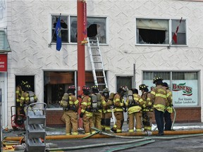 Firefighters on the scene of a fire at the Italian Bakery on 97 St. Near 106 Ave. where two people were taken to hospital earlier this morning in Edmonton, April 3, 2020. Ed Kaiser/Postmedia