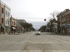 The intersection of Whyte Avenue and 104 Street is nearly deserted on April 17, 2020. An Edmonton man who was handing out religious material in Old Strathcona last week is facing a $1,200 fine following complaints he wasn’t complying with physical distancing guidelines.
