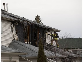 Firefighters work at the scene of a fire at the Akam Patna complex at 38 Street and 39 Avenue on Monday, April 20, 2020, in Edmonton . Edmonton Fire Rescue Services were called to the scene at 7 a.m. and brought the fire under control just after 8 a.m.