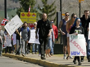 More than 200 protesters rallied in front of the Alberta Legislature on April 29, 2020.