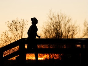 A runner exercises on river valley stairs that the City of Edmonton says are closed to repetitive exercise due to the COVID-19 pandemic at Constable Ezio Faraone Park in Edmonton, on Thursday, April 30, 2020.