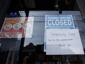 A closed sign is displayed on the door of a restaurant in Toronto, Ontario, Canada, on Wednesday, March 25, 2020.