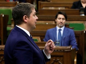 Canada's Conservative Party leader Andrew Scheer speaks in the House of Commons as legislators convene to give the government power to inject billions of dollars in emergency cash to help individuals and businesses through the economic crunch caused by the coronavirus disease (COVID-19) outbreak, on Parliament Hill in Ottawa, Ontario, Canada April 11, 2020.
