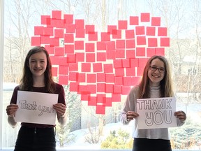 Kenzie (left) and Addison Bliss decided to become involved and create this large colourful heart when their dad Jamie Bliss, from the University of Alberta Hospital’s communications department, told them he was helping foundations throughout Alberta mount a campaign - #FoundationsOfGratitude - to thank frontline health-care workers and supporters for their courage and care in taking care of patients dealing with COVID-19.